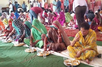 Yashodhara Raje sits on floor with sanitation workers, felicitates them